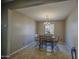 Dining room view showcasing the wood dining table and decorative chandelier at 6811 W Darrel Rd, Laveen, AZ 85339