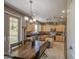 Kitchen and dining area showcasing stainless steel appliances and light wood cabinetry at 6811 W Darrel Rd, Laveen, AZ 85339