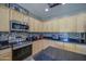 Bright kitchen features stainless steel appliances, granite countertops, and a stylish tile backsplash at 6811 W Darrel Rd, Laveen, AZ 85339