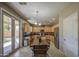 Kitchen and dining area view with stainless steel appliances, light wood cabinetry and large window at 6811 W Darrel Rd, Laveen, AZ 85339