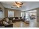 Comfortable living room featuring a large sectional and seamless flow into the kitchen at 6811 W Darrel Rd, Laveen, AZ 85339