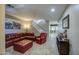 Inviting living room area with tile floors, a plush leather sofa and stairs leading to the upper level at 6811 W Darrel Rd, Laveen, AZ 85339