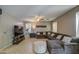Inviting living room with a sectional couch, ceiling fan and large windows at 6811 W Darrel Rd, Laveen, AZ 85339