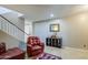 Cozy living space featuring tile flooring, a comfortable leather sofa set and stairs leading upstairs at 6811 W Darrel Rd, Laveen, AZ 85339