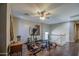 Spacious loft area features wood-look floors, ceiling fan, natural light and access to upstairs bedrooms at 6811 W Darrel Rd, Laveen, AZ 85339