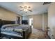 Spacious main bedroom featuring a ceiling fan and doorway to another room at 6811 W Darrel Rd, Laveen, AZ 85339