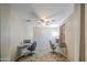 Office space with two desks, carpeting, and a ceiling fan at 6811 W Darrel Rd, Laveen, AZ 85339