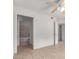 A bright bedroom that leads to a bathroom and walk in closet at 6901 W Mackenzie Dr # 1287, Phoenix, AZ 85033