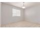 Bedroom with neutral walls, tile flooring, a window, and ceiling lighting at 6901 W Mackenzie Dr # 1287, Phoenix, AZ 85033