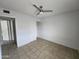Bedroom featuring tile floors and a ceiling fan at 6901 W Mackenzie Dr # 1287, Phoenix, AZ 85033