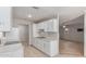 Kitchen has white cabinets, tile floors, and stainless steel double sinks at 6901 W Mackenzie Dr # 1287, Phoenix, AZ 85033