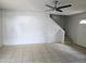 Bright living room featuring tile floors and a modern ceiling fan at 6901 W Mackenzie Dr # 1287, Phoenix, AZ 85033