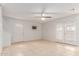 Bright living room with neutral walls, tile flooring, and lots of natural light at 6901 W Mackenzie Dr # 1287, Phoenix, AZ 85033