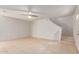 Living room features neutral walls, tile flooring, and access to the stairs at 6901 W Mackenzie Dr # 1287, Phoenix, AZ 85033