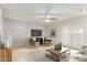 Bright living room with neutral walls, ceiling fan, and lots of natural light at 6901 W Mackenzie Dr # 1287, Phoenix, AZ 85033