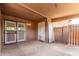Covered patio with barred door and concrete flooring offers space for outdoor living and storage at 6901 W Mackenzie Dr # 1287, Phoenix, AZ 85033