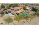 A bird's eye view of a home with a private backyard, pool, covered patio, and landscaping in a desert community at 8830 S 20Th S Pl, Phoenix, AZ 85042