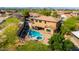 An aerial view showcases a large private yard with a pool, spa, covered patio, and desert landscaping at 8830 S 20Th S Pl, Phoenix, AZ 85042