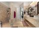 Beautiful bathroom showcases tiled walls, stone sinks, and a walk-in shower at 8830 S 20Th S Pl, Phoenix, AZ 85042