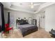 Cozy bedroom features a tray ceiling, tile floors, and a glass door to the outside at 8830 S 20Th S Pl, Phoenix, AZ 85042