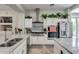 Modern kitchen with white cabinets, stainless steel appliances, and stunning granite countertops at 8830 S 20Th S Pl, Phoenix, AZ 85042