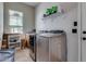 Practical laundry room featuring modern machines and ample storage space for efficient household management at 8830 S 20Th S Pl, Phoenix, AZ 85042