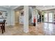 Bright living area boasts travertine flooring and access to stairs and a pool through large sliding glass doors at 8830 S 20Th S Pl, Phoenix, AZ 85042