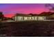 A twilight view of the home's backyard showing desert landscaping and the back exterior at 9357 W Canyon Verde Dr, Casa Grande, AZ 85194