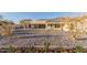 Expansive backyard with desert landscaping and covered patio, ideal for outdoor living at 9357 W Canyon Verde Dr, Casa Grande, AZ 85194