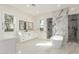 Luxurious bathroom with a soaking tub, glass-enclosed shower, and dual vanity at 9357 W Canyon Verde Dr, Casa Grande, AZ 85194