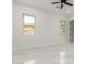 Inviting bedroom with white marble floors and bright windows offering scenic views at 9357 W Canyon Verde Dr, Casa Grande, AZ 85194