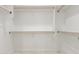Spacious walk-in closet with wooden clothes racks for maximum storage at 9357 W Canyon Verde Dr, Casa Grande, AZ 85194