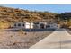 Attractive single-story home with modern windows, attached garage, and concrete driveway at 9357 W Canyon Verde Dr, Casa Grande, AZ 85194