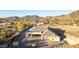 Desert home showcasing a large lot, elegant design, and beautiful desert landscape at 9357 W Canyon Verde Dr, Casa Grande, AZ 85194