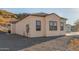Side view of single-story home with desert landscaping and a hill backdrop at 9357 W Canyon Verde Dr, Casa Grande, AZ 85194