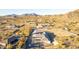 Desert home featuring a long driveway and mountain views at 9357 W Canyon Verde Dr, Casa Grande, AZ 85194