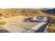 New home with spacious lot, desert landscape, and private driveway against a mountain backdrop at 9357 W Canyon Verde Dr, Casa Grande, AZ 85194