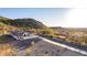 Desert estate boasting a long driveway, native landscaping, and breathtaking mountain views at 9357 W Canyon Verde Dr, Casa Grande, AZ 85194