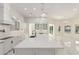 Spacious kitchen with white countertops, an island, and crystal pendant lighting at 9357 W Canyon Verde Dr, Casa Grande, AZ 85194