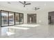 Large living room with chandelier, recessed lights, and marble flooring at 9357 W Canyon Verde Dr, Casa Grande, AZ 85194