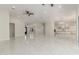 Expansive living room with marble floors, chandeliers and recessed lights at 9357 W Canyon Verde Dr, Casa Grande, AZ 85194