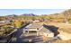 Modern home with desert landscaping, featuring a covered patio and stunning mountain views at 9357 W Canyon Verde Dr, Casa Grande, AZ 85194