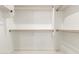 Well-organized walk-in closet with white shelves and racks, providing generous storage space at 9357 W Canyon Verde Dr, Casa Grande, AZ 85194