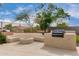 Private backyard patio with built in seating, bbq, and fireplace, great for gatherings at 9825 E Gary St, Mesa, AZ 85207