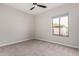Well-lit bedroom with a large window and ceiling fan at 9825 E Gary St, Mesa, AZ 85207