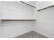 Walk-in closet with built-in shelving and hanging rods at 9825 E Gary St, Mesa, AZ 85207