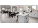 Spacious kitchen island with seating opens to a dining area and a separate living room at 9825 E Gary St, Mesa, AZ 85207