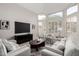 Bright and airy living room area with large windows and neutral decor at 9825 E Gary St, Mesa, AZ 85207