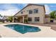 Inviting backyard pool with spacious deck perfect for entertaining by the two-story home at 9825 E Gary St, Mesa, AZ 85207