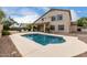 Inviting backyard pool with spacious deck perfect for entertaining by the two-story home at 9825 E Gary St, Mesa, AZ 85207